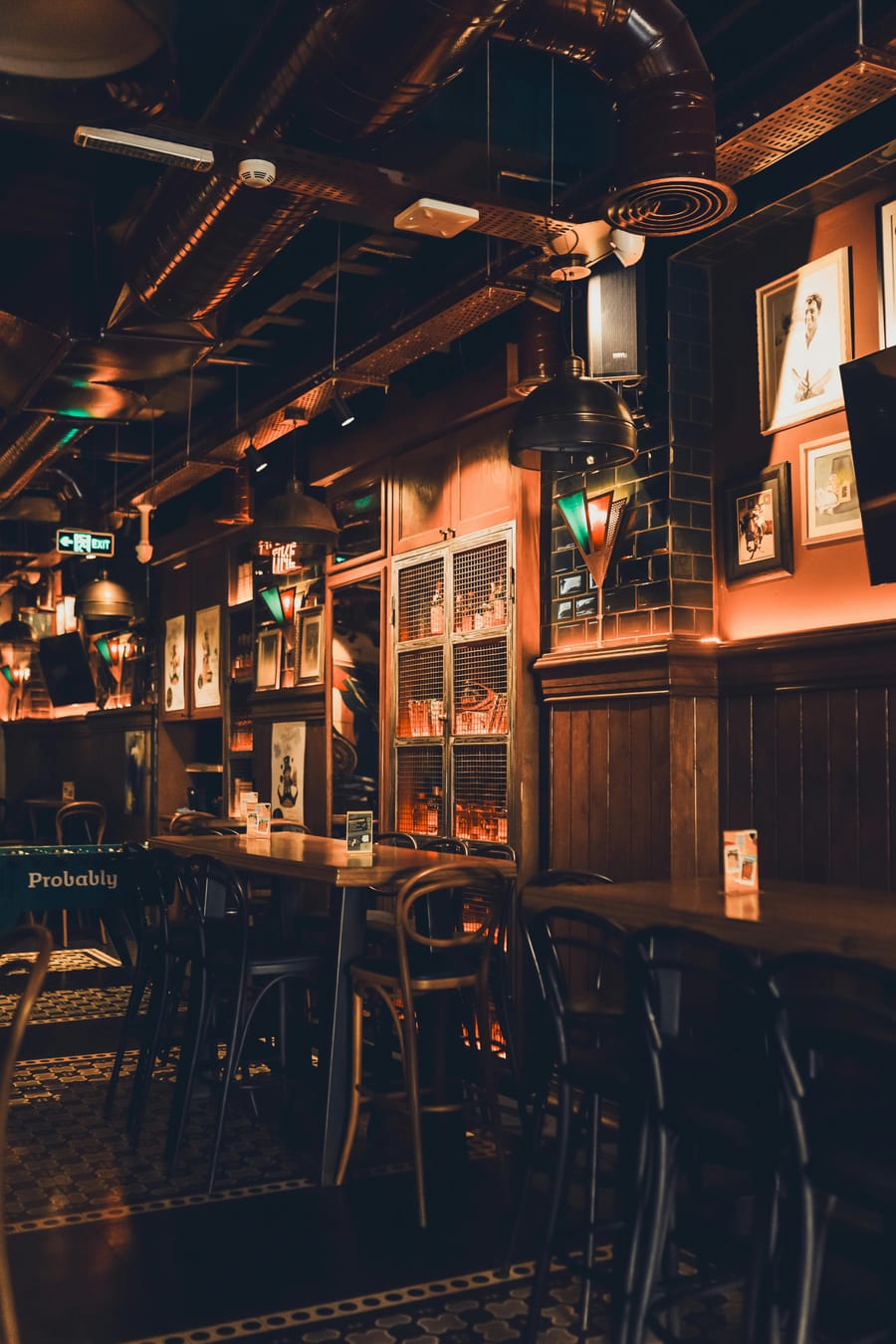 Charming vintage pub interior with low, warm lighting.
