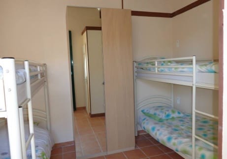 Interior of The Crew House: bedroom shared by yacht crew.