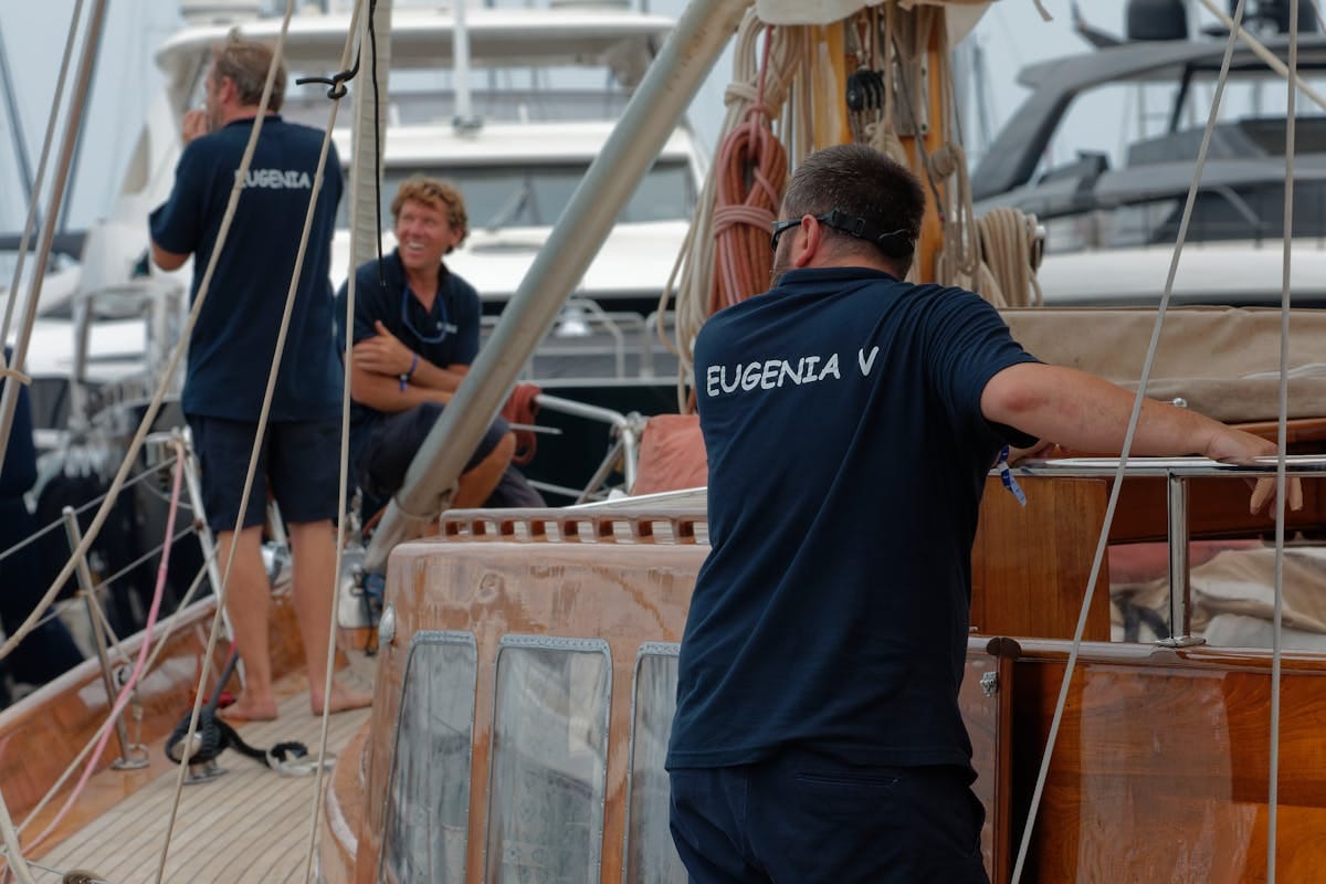 Yacht crew preparing a superyacht for departure at the harbour
